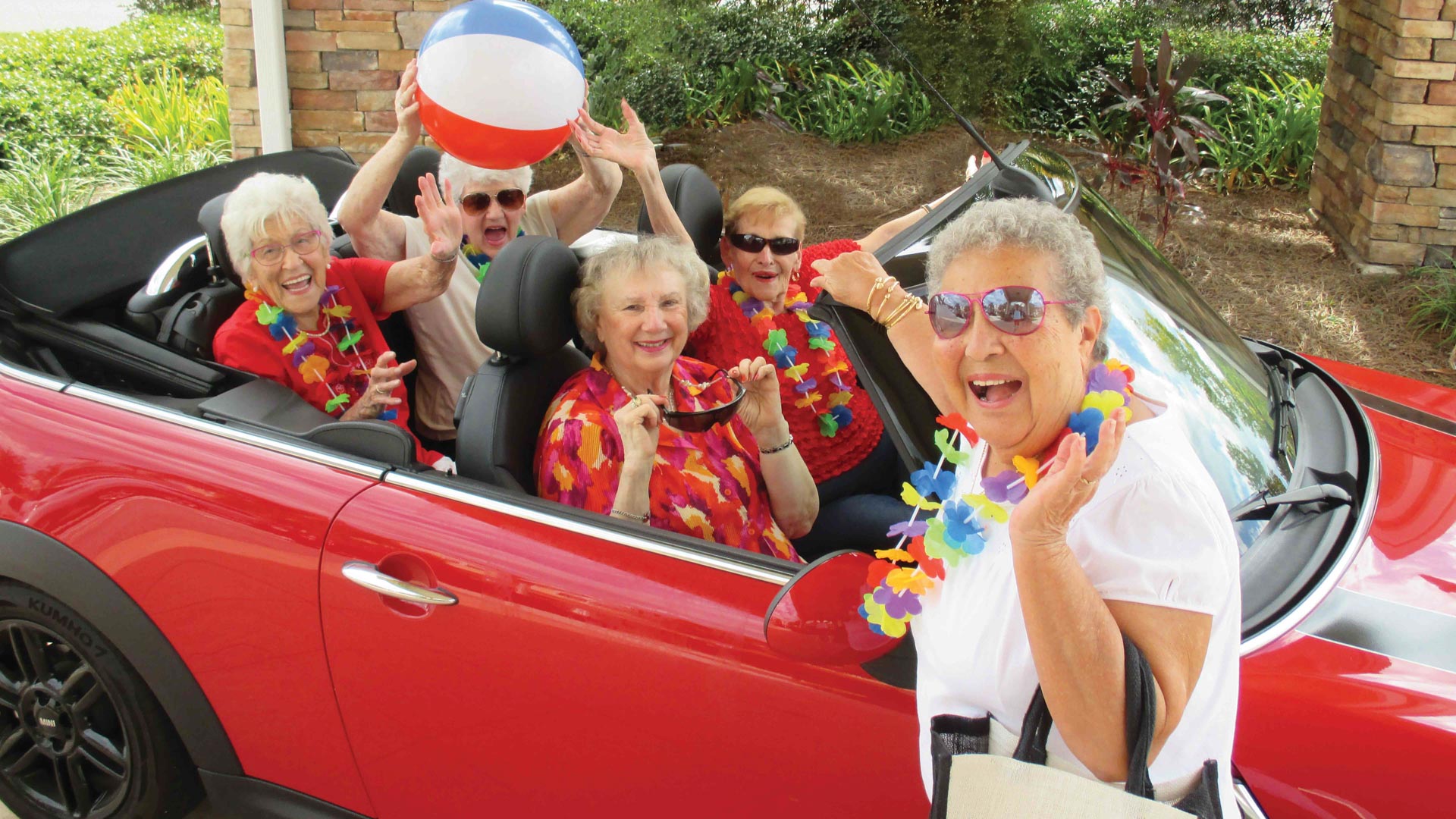 Sanford Estates women in red car
